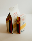 1976 Espresso bag of beans with a 1976 Espresso coffee capsules box.