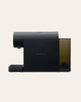Black espresso coffee machine on a beige background