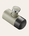 Hand pump espresso brewer for travel on a beige background
