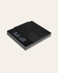 Black electronic scale with digital display on a white background