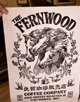 A person holding up a black and white print of a horse with the text 'THE FERNWOOD COFFEE COMPANY' displayed at the top.