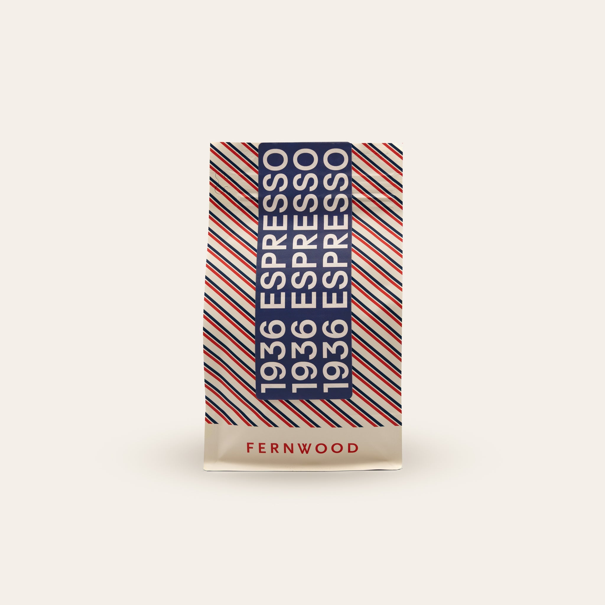 Fernwood 1936 Espresso coffee package with red and blue stripes on a beige background