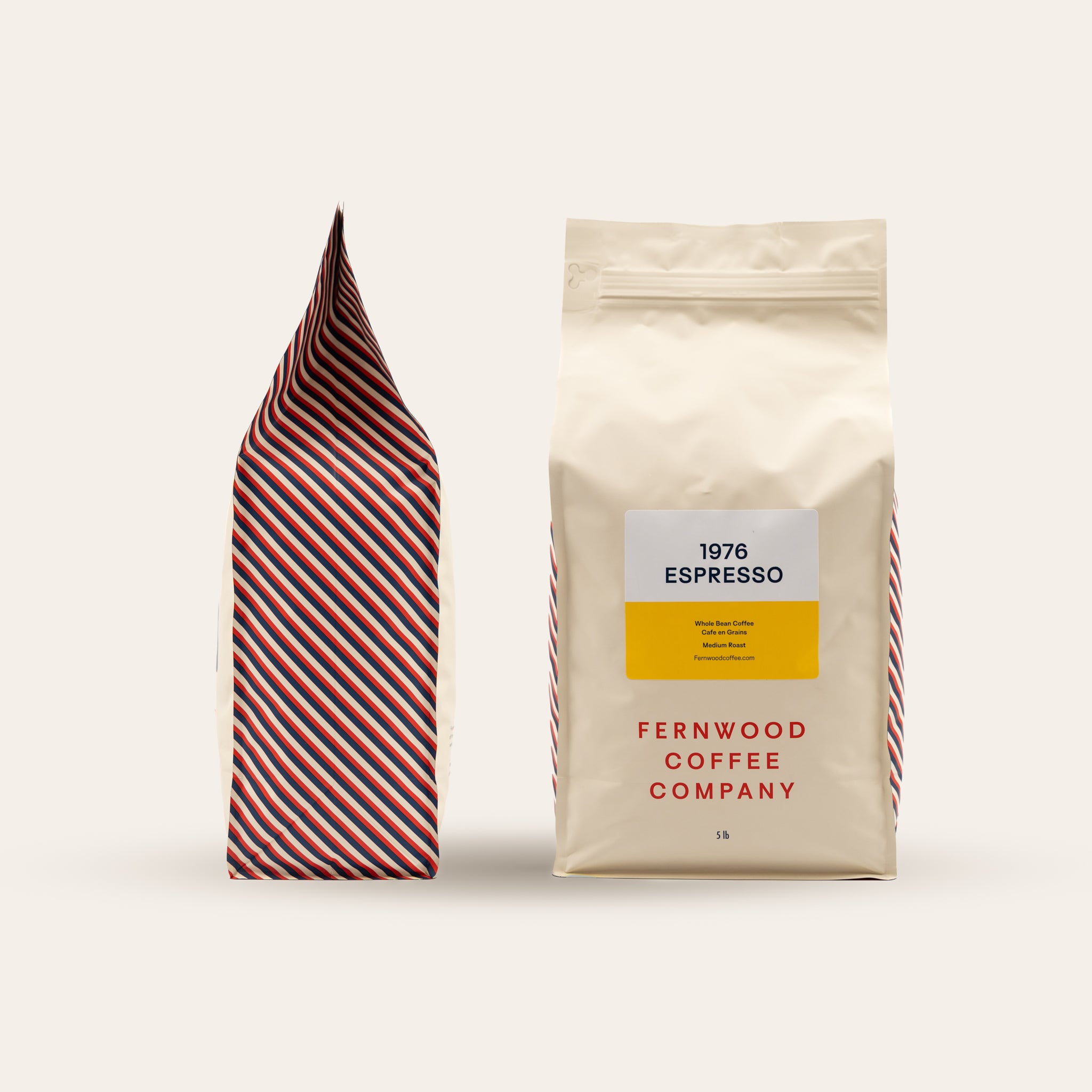 Two 5lb 1976 Espresso bags on a beige background