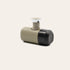 Minipresso laying on it's side with pump lever up on a beige background