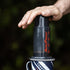 Original AeroPress coffee maker on a coffee cup brewing coffee