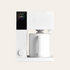 Fellow coffee maker front view on a beige coloured background