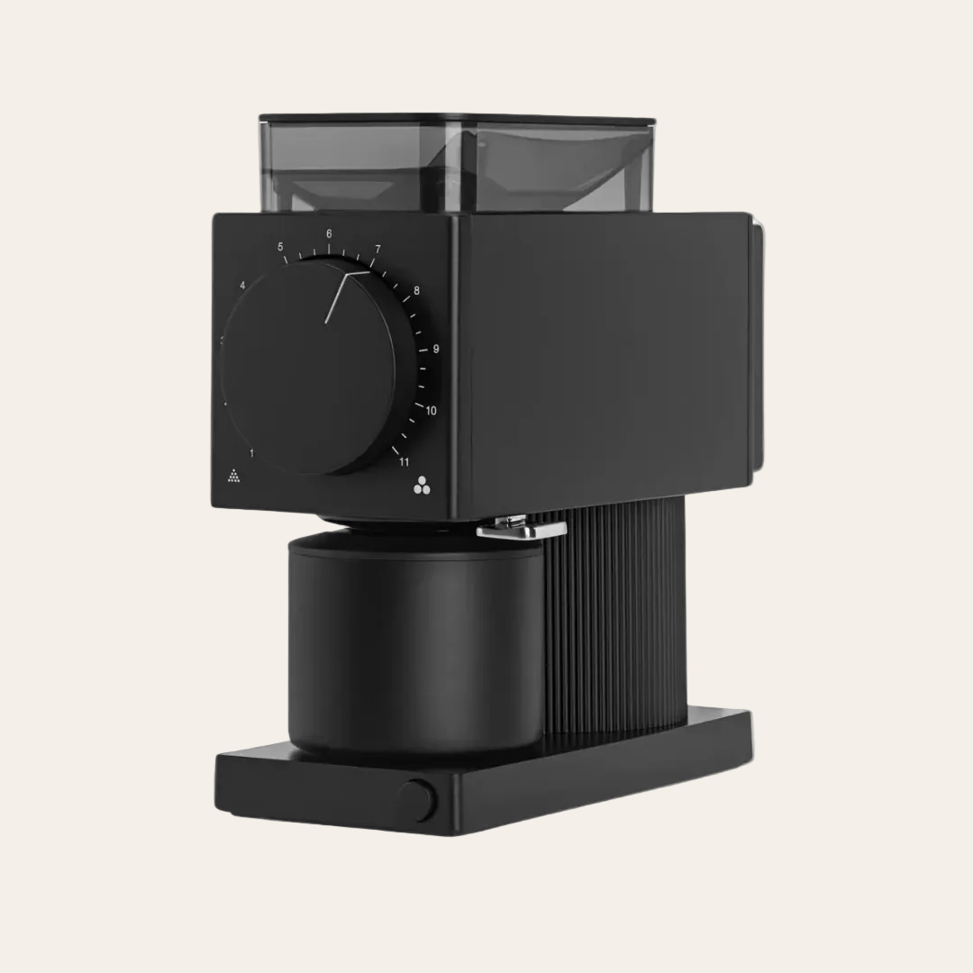 Fellow Ode Black coffee grinder on a light beige background