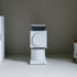 Fellow Ode coffee grinder on a gray surface with a neutral background