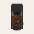 Black coffee grinder with coffee beans on a beige background