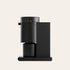 Black coffee machine on a beige background