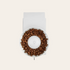 Coffee grinder top down view with beans on a beige background