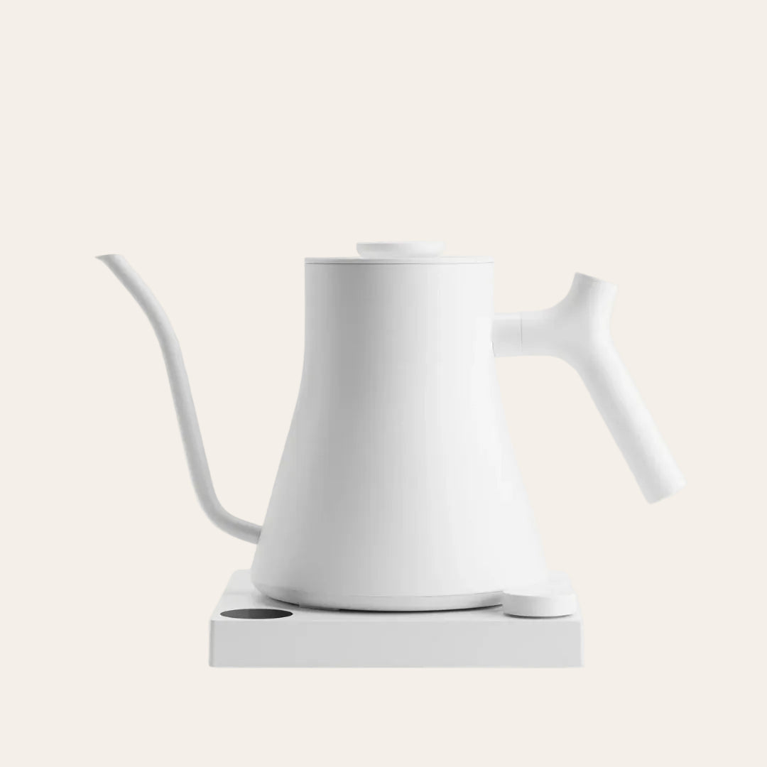 White electric kettle on a light beige background