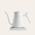 White electric kettle on a light beige background