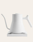 White electric kettle on a light beige background