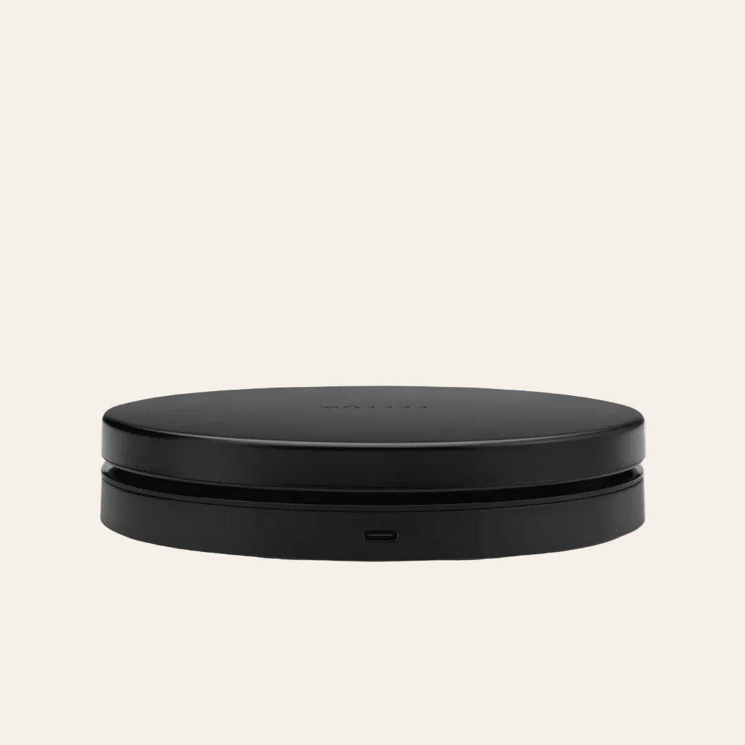 Black scale showing charging port on a beige background