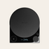 Black digital kitchen scale with 'Fellow' branding on a beige background