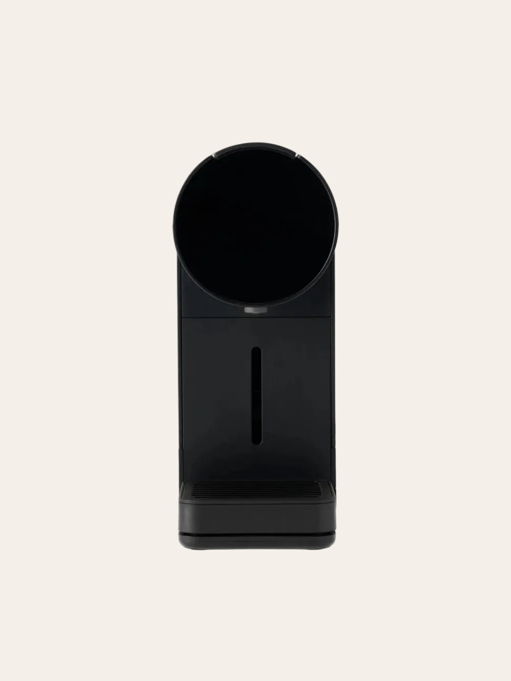 Black coffee maker on a beige background