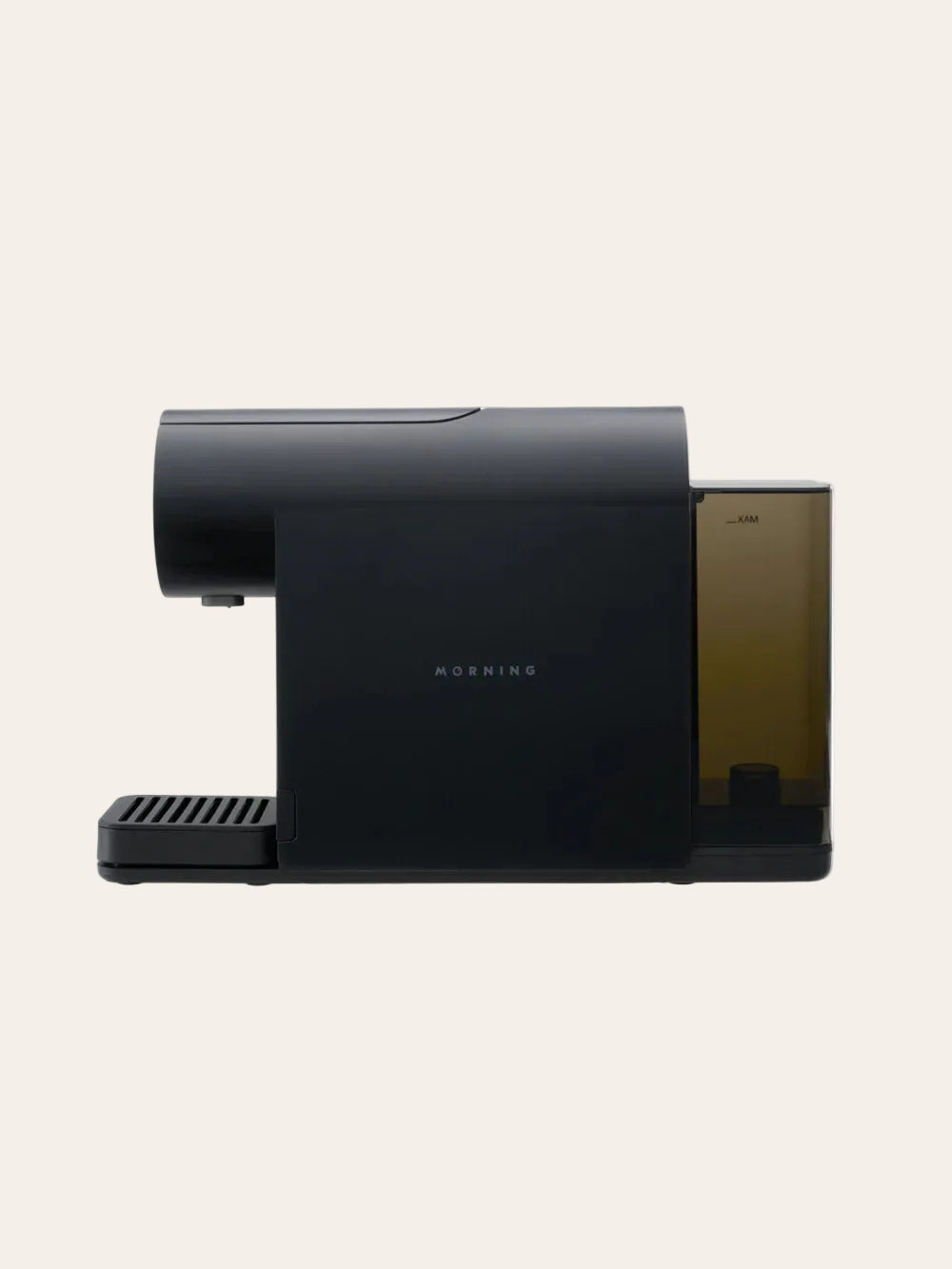 Black espresso coffee machine on a beige background
