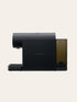 Black espresso coffee machine on a beige background