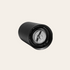 Black manual coffee grinder bottom on beige background