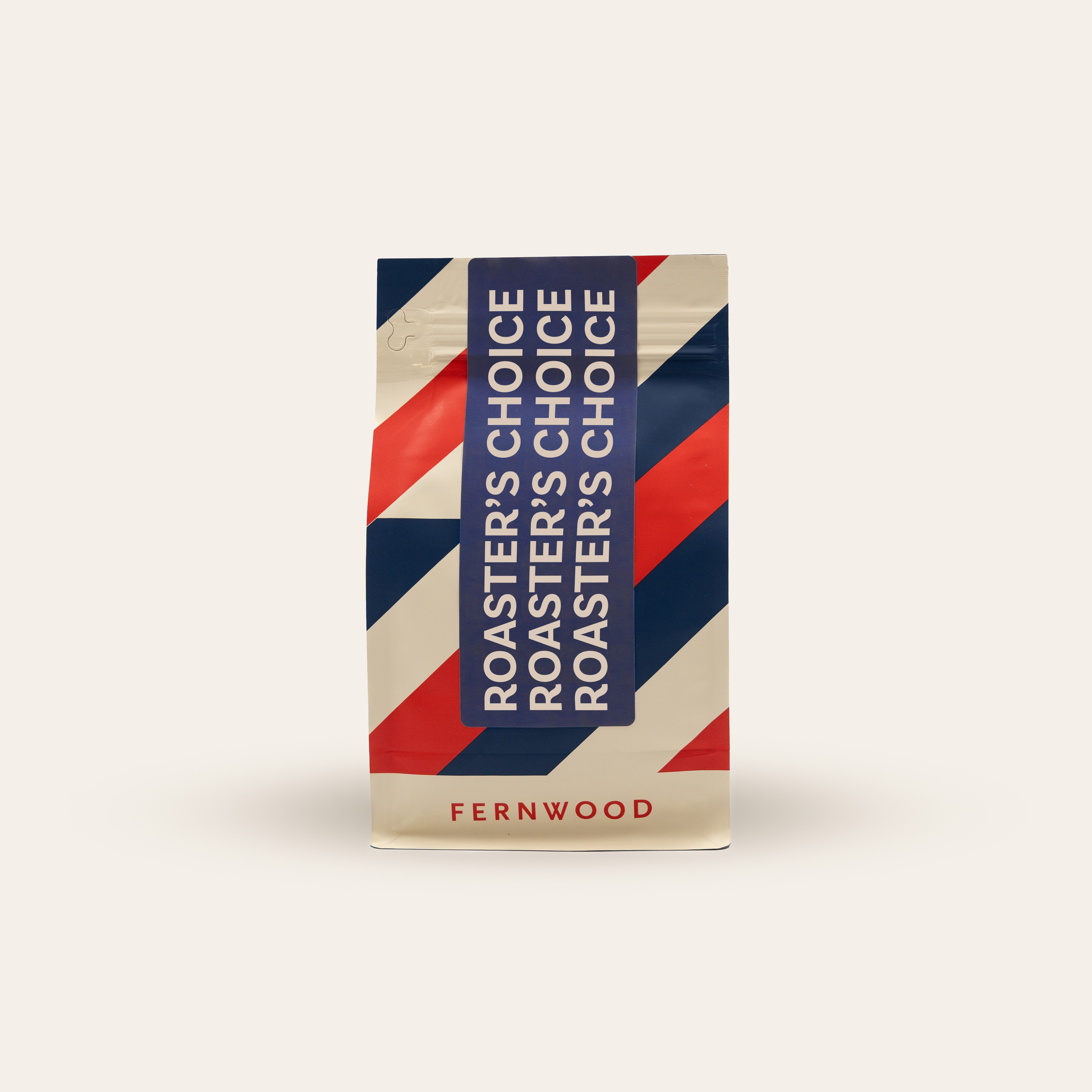 Fernwood Roaster's Choice coffee package with red, white, and blue stripes on a beige background