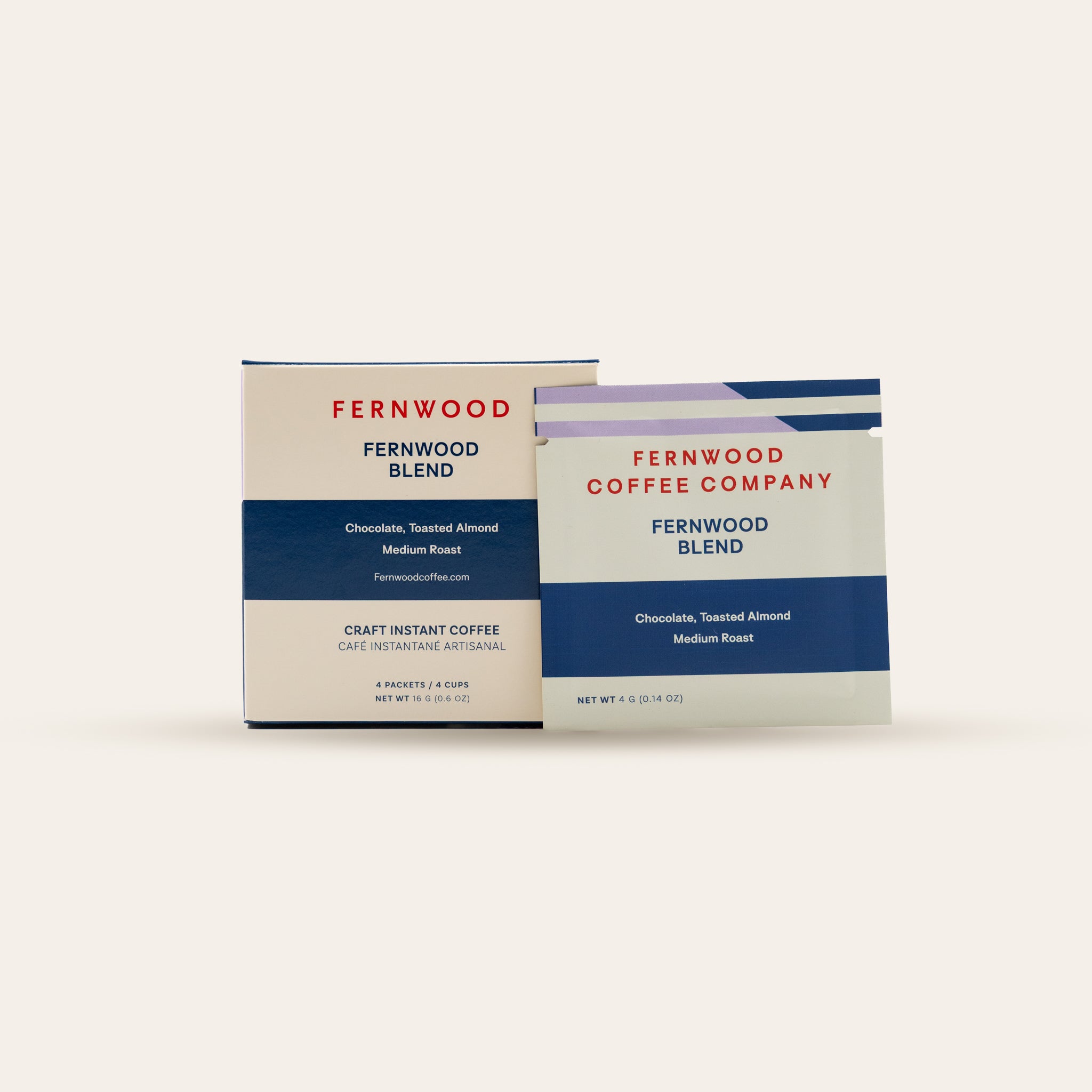 A box and pouch of Fernwood Blend Instant Coffee on a beige background