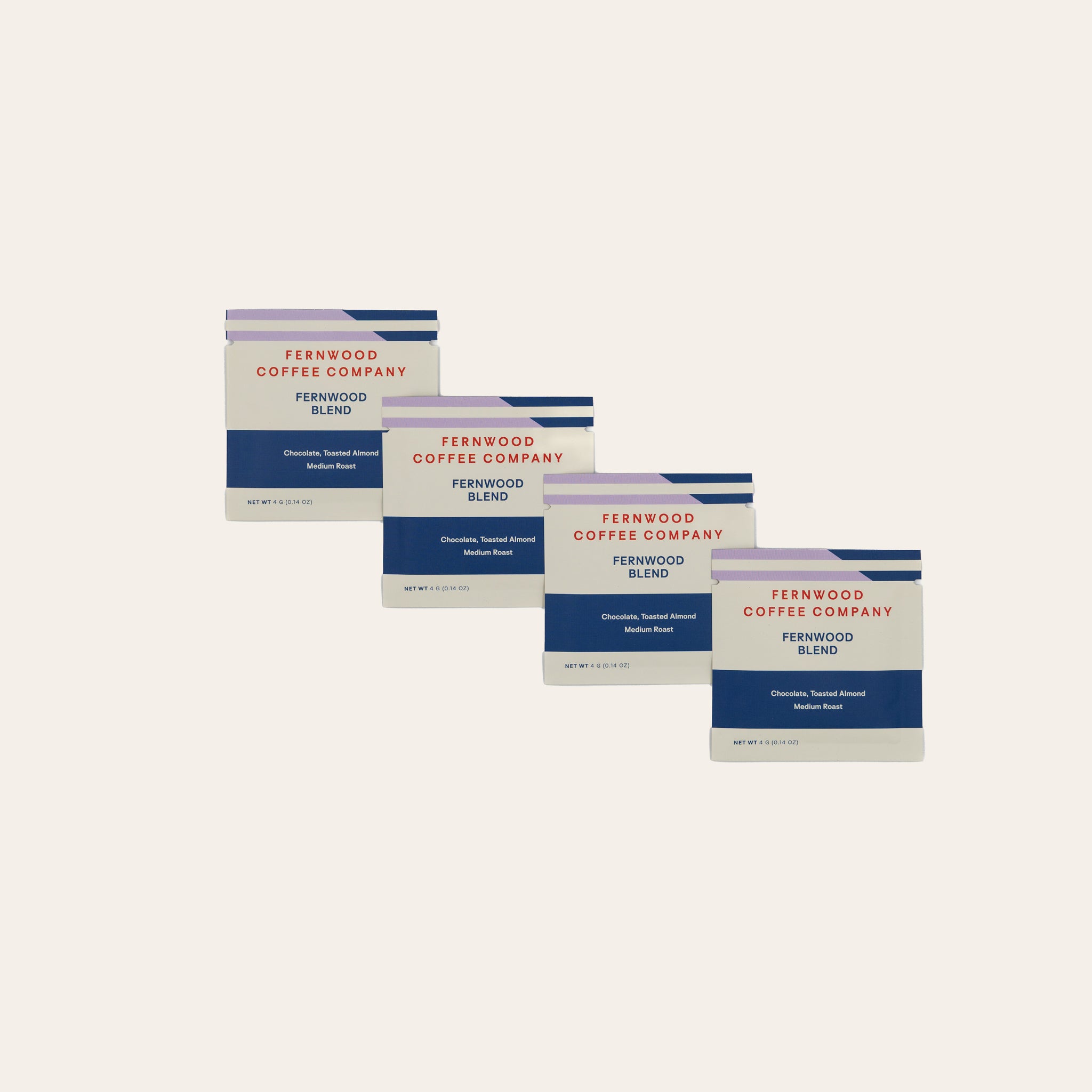 Five packages of Fernwood Blend Instant coffee on a beige background.