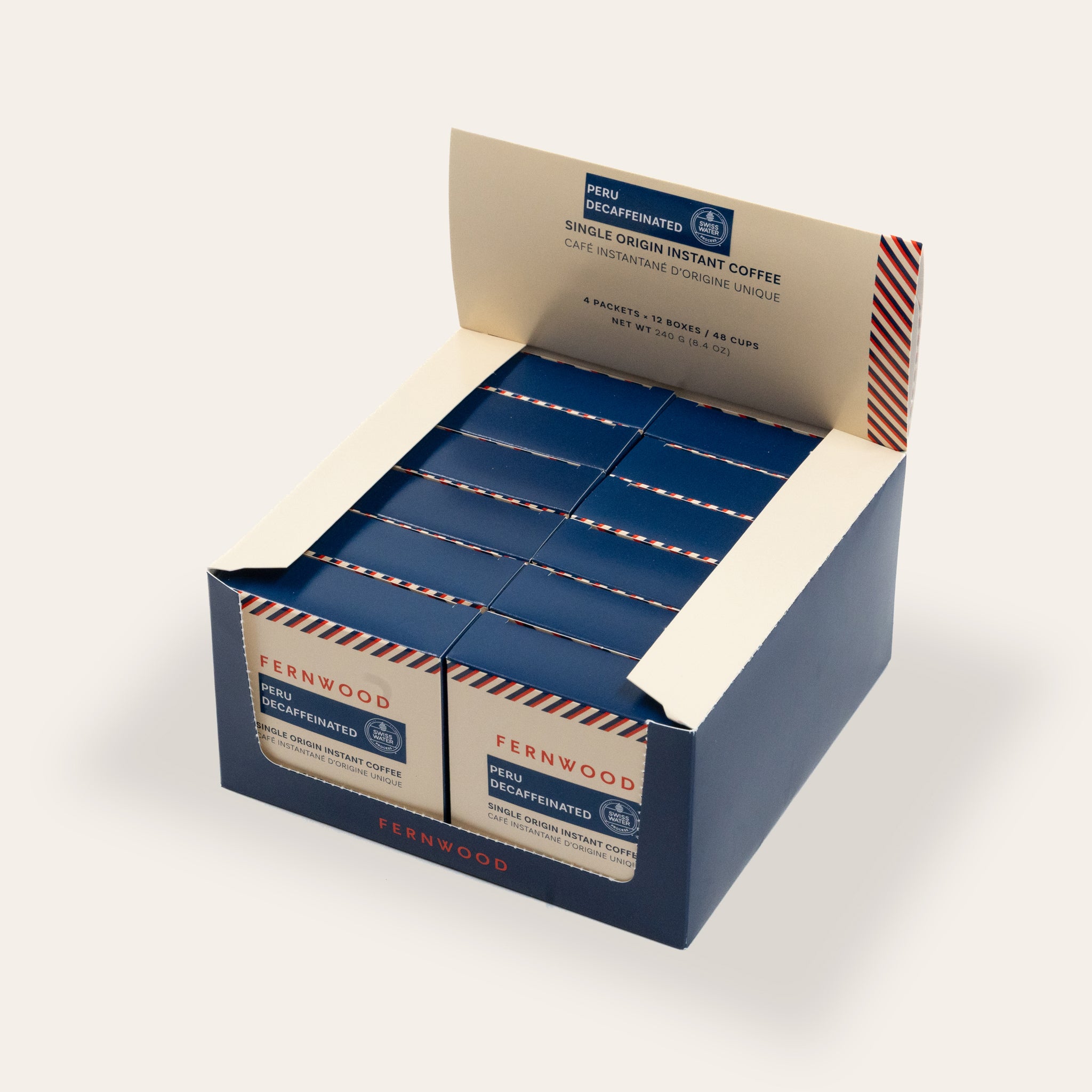 Display box of Fernwood Peru instant coffee on a beige background