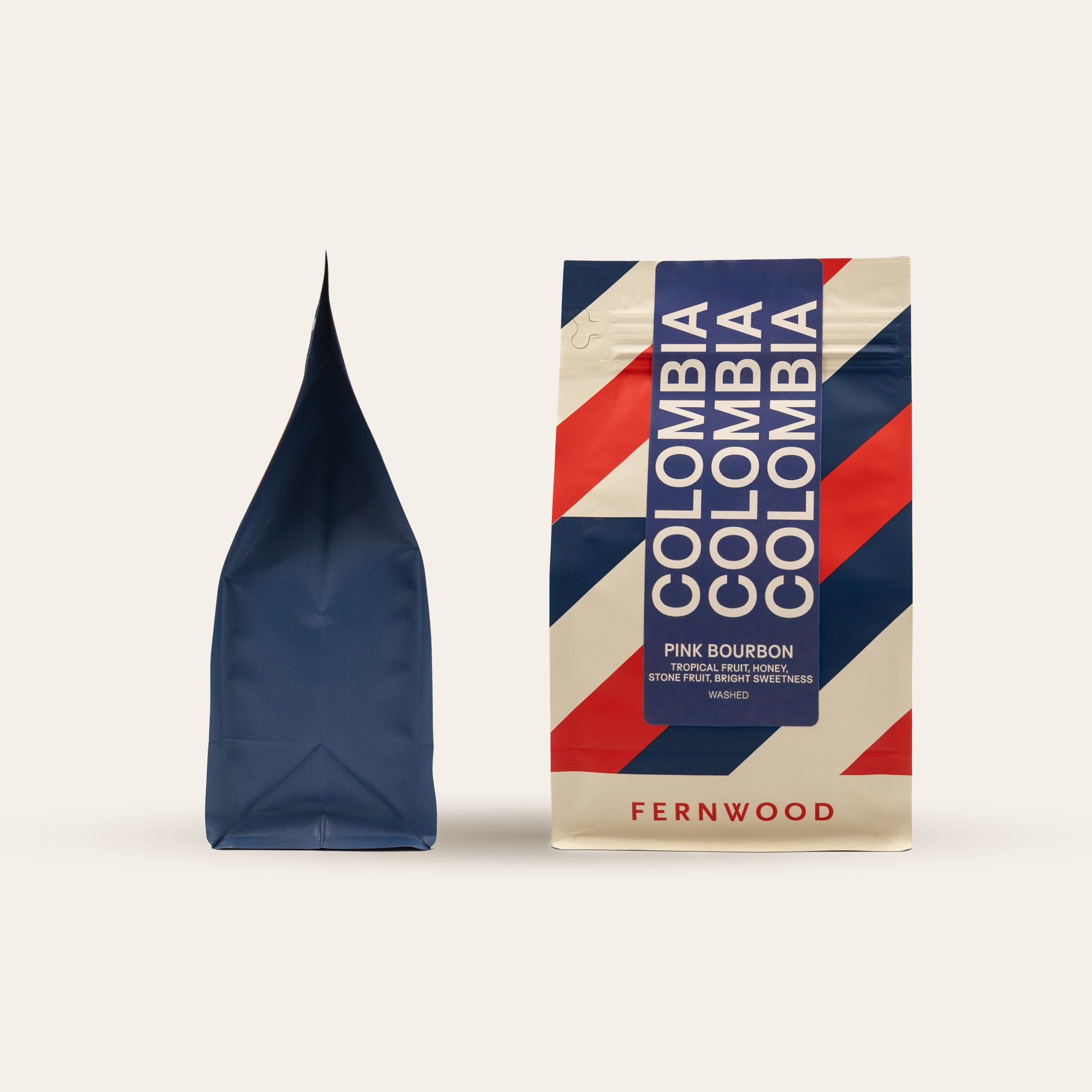 Fernwood Colombia Pink Bourbon coffee package with a blue and red striped coffee bag on a white background.