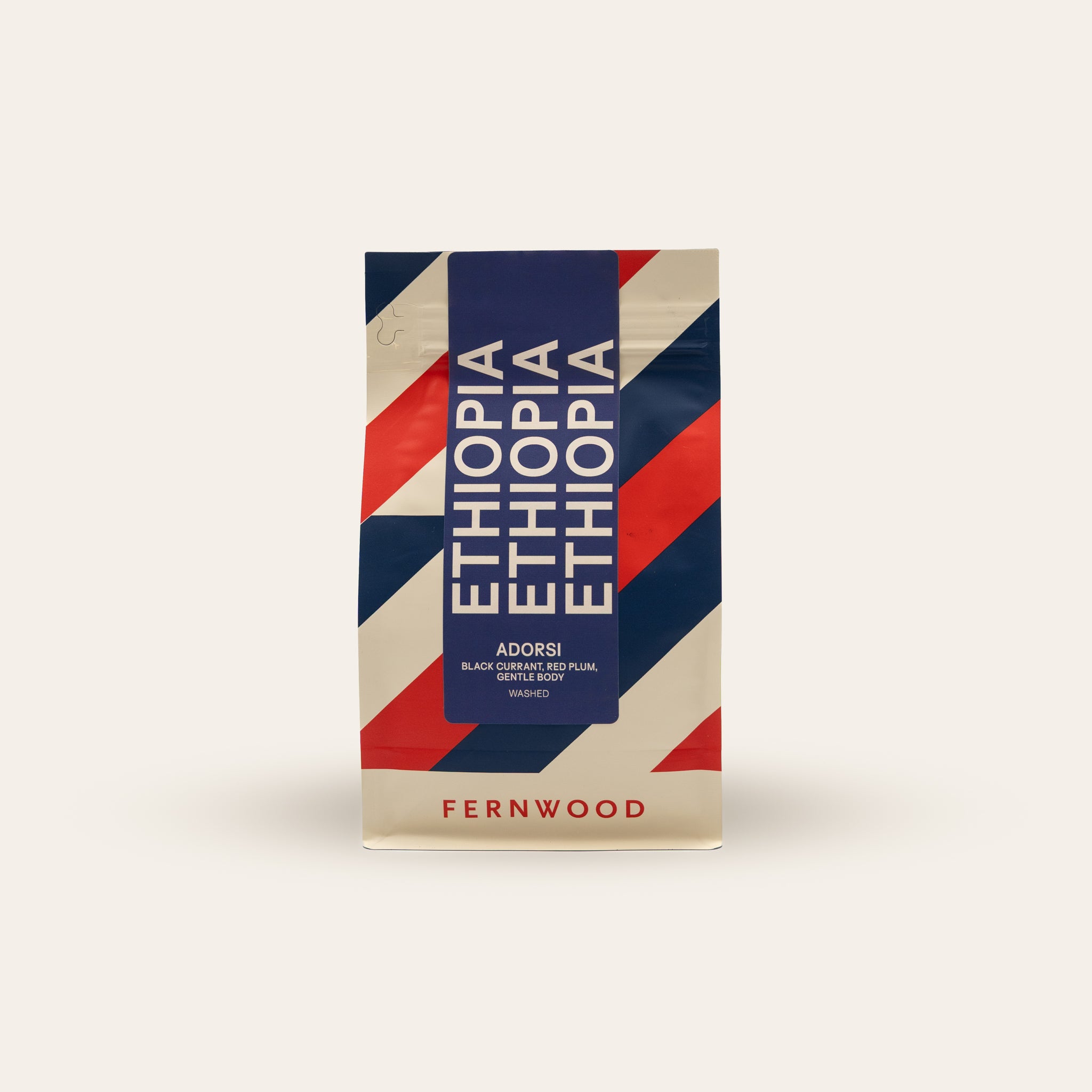 Ethiopia coffee package with red, white, and blue stripes design on a beige background