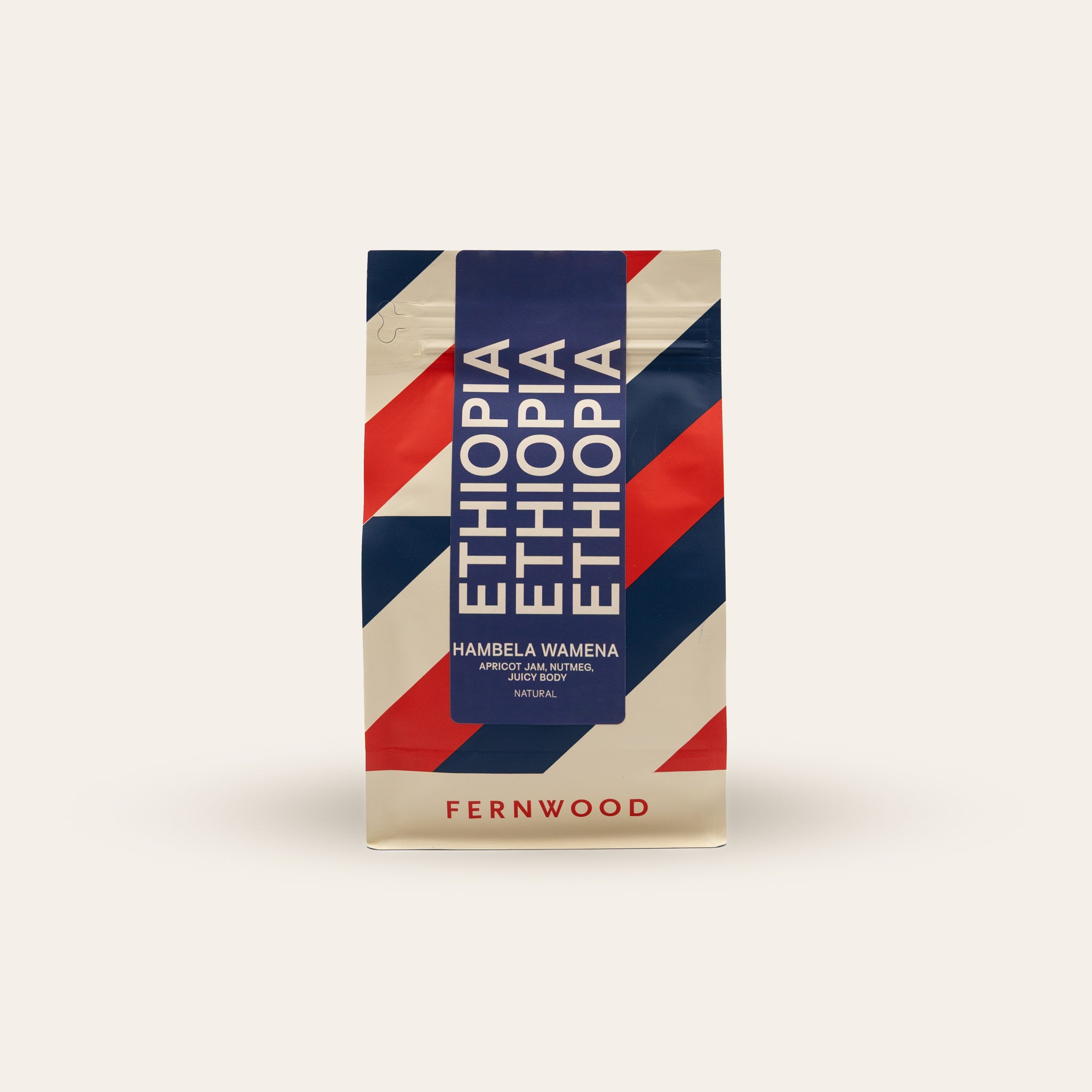 Fernwood Ethiopia coffee package with red, white, and blue stripe design on a beige background