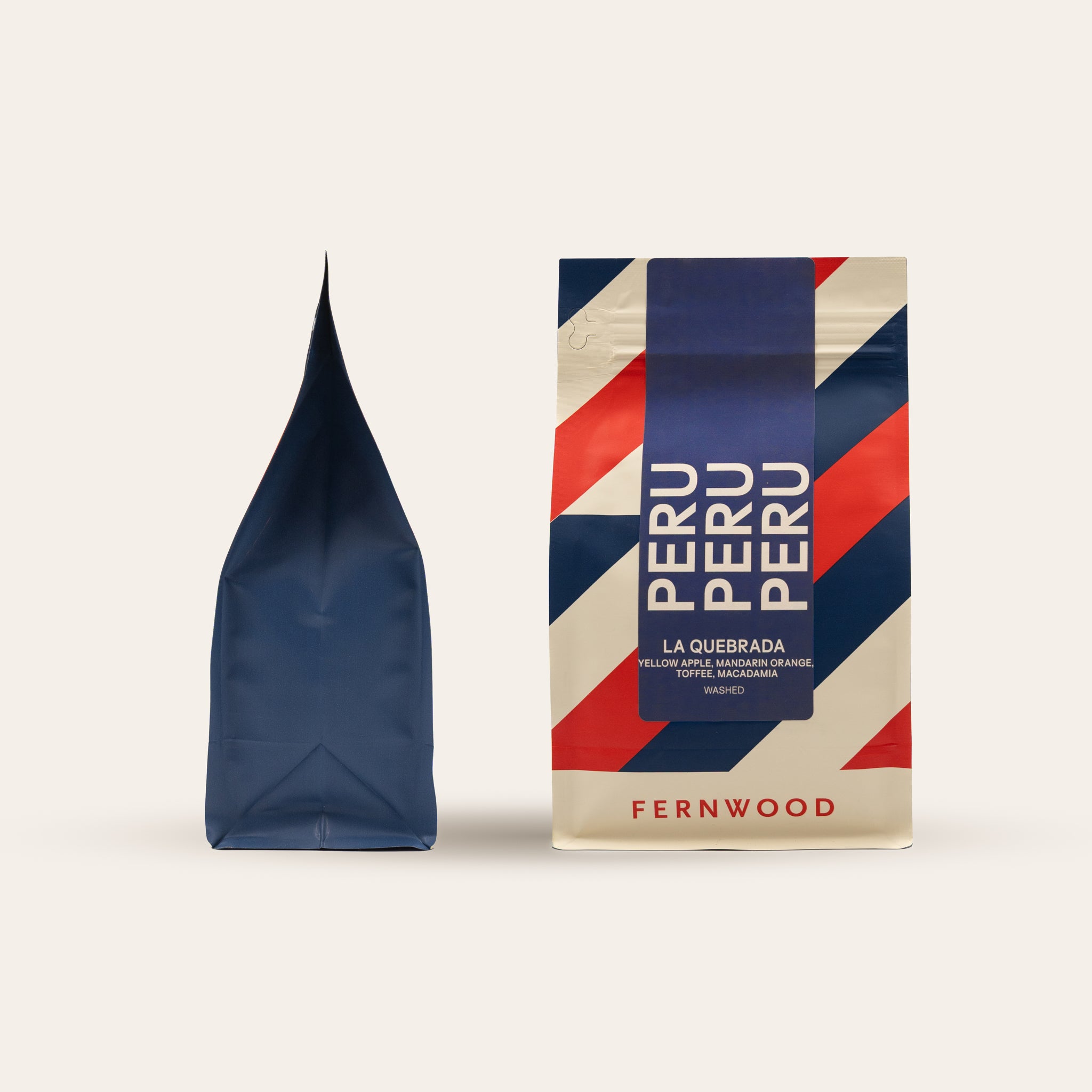 Fernwood Peru coffee package with a blue and red striped coffee bag on a beige background.