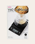 Hario V60 Drip Scale packaging with digital display and coffee brewing setup.