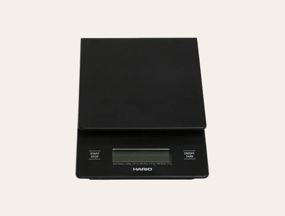 Black Hario digital scale on a white background