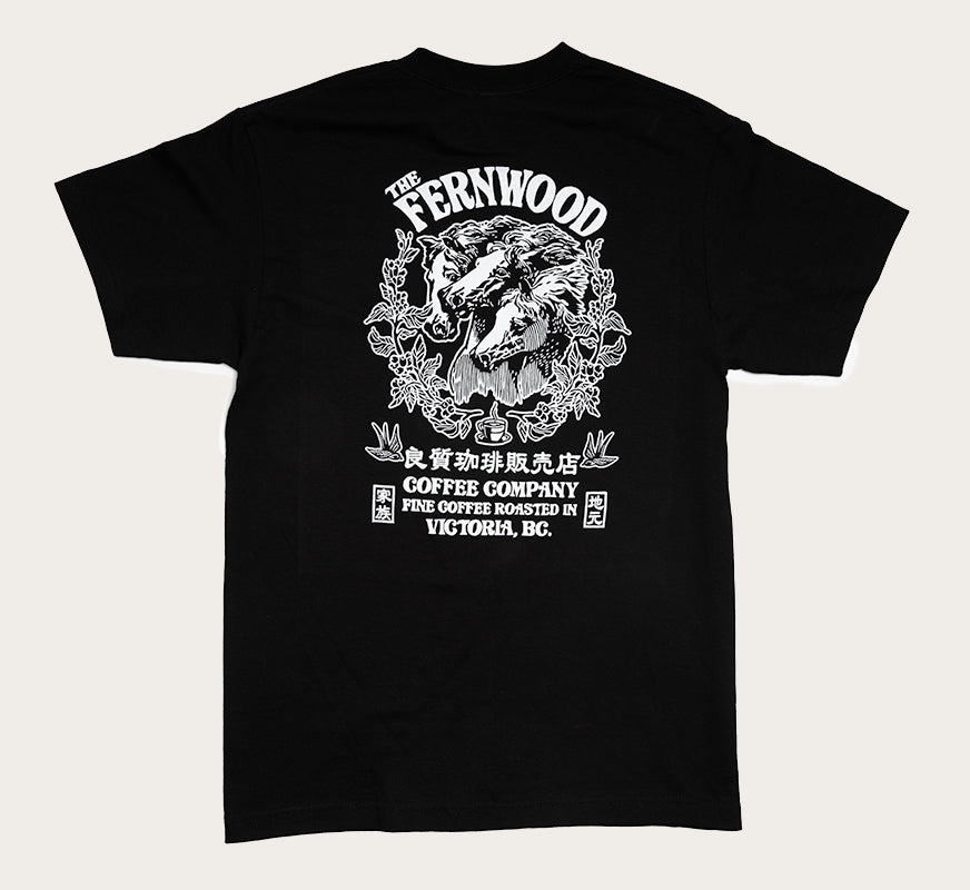 A black t-shirt featuring a black printed design of three horse heads and floral elements, with the text 'FERNWOOD COFFEE COMPANY'.