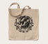 Canvas tote bag with a black printed horse surrounded by floral art on the front side.